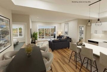 Plymouth apartment for rent - A modern living room with a black dining table and grey chairs.