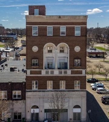 Alliance apartment for rent - an aerial view of a tall brick building in a city