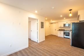 Los Angeles apartment for rent - A kitchen area with a refrigerator, microwave, and oven.
