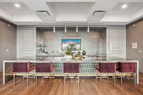 Hauppauge apartment for rent - a large dining room with a long table and chairs