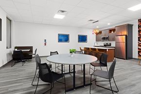 Neenah apartment for rent - A modern dining room with a round table and chairs.