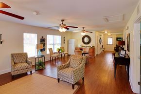York apartment for rent - A living room with a fan and chairs.