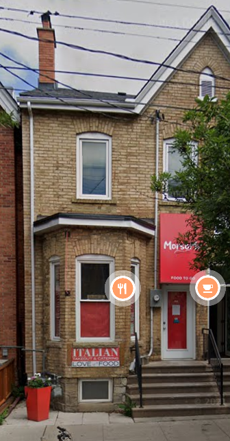 Toronto apartment for rent - A brick building with a red door and a sign that says Italian Love Food.
