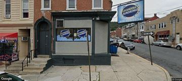 Reading apartment for rent - A street view of a laundromat with a sign that reads "Washington Laundromat.".