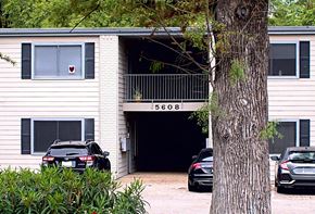 Austin apartment for rent - an apartment building with cars parked in front of it