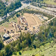 San Diego apartment for rent - A large open field with a few buildings and cars.