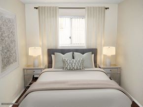 Upland apartment for rent - a bedroom with a large bed and a window