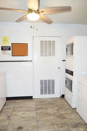 Arcadia apartment for rent - a kitchen with a white refrigerator and a ceiling fan