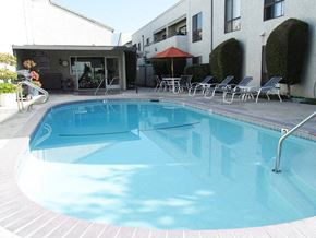 Arcadia apartment for rent - a large swimming pool in front of a building