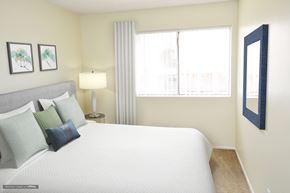 Van Nuys apartment for rent - a bedroom with a large bed and a window