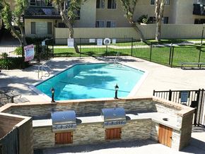 Upland apartment for rent - a swimming pool in front of an apartment building