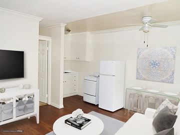 Pasadena apartment for rent - A living room with a white couch and a television.