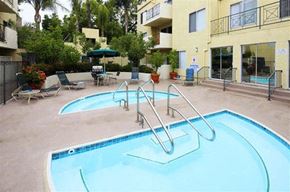 Burbank apartment for rent - a large swimming pool in front of an apartment building