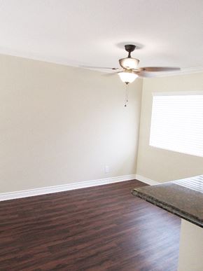 Burbank apartment for rent - an empty bedroom with a ceiling fan and a window