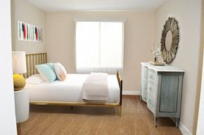 Burbank apartment for rent - a bedroom with a bed and a dresser and a window