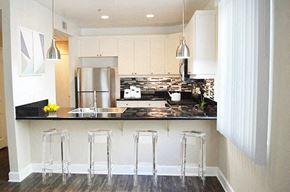 Burbank apartment for rent - a kitchen with a counter and three stools