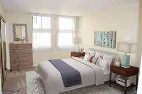 Burbank apartment for rent - a bedroom with a bed and two windows