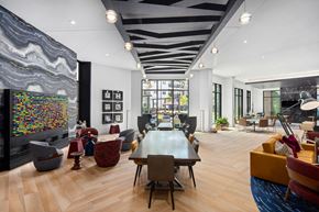 Durham apartment for rent - Spacious clubhouse with wood floors and art with multiple seating and lounge areas at MAA Nixie luxury apartments in Durham, NC