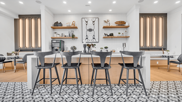 Raleigh apartment for rent - a dining area with a large table and chairs and a living room with a kitchen