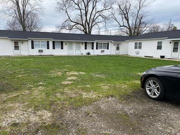 Glasford apartment for rent - a white house with a car parked in front of it
