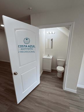 San Antonio apartment for rent - a door leading into a bathroom with a toilet and a sink