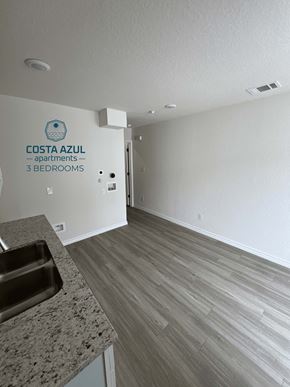 San Antonio apartment for rent - a view from the kitchen into the living room and the hallway to the bedrooms