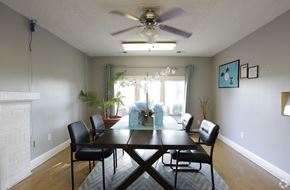 Kansas City apartment for rent - a dining room with a large table and a ceiling fan