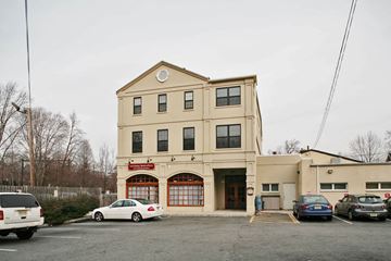 Montclair apartment for rent - A fire station with a white car parked in front.