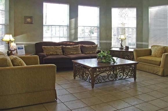 Kissimmee apartment for rent - a living room with couches and a coffee table