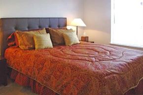 Kissimmee apartment for rent - a bedroom with a bed with pillows on it