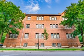 Chicago apartment for rent - a red brick building with trees in front of it