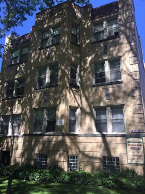 Chicago apartment for rent - the facade of a building with shadows on it