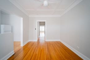 Chicago apartment for rent - a living room with white walls and wooden floors