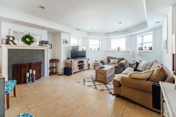 Chicago apartment for rent - the living room has a fireplace and a tv