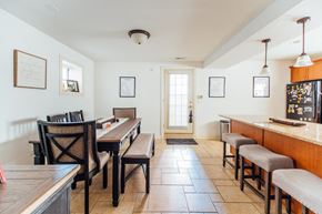 Chicago apartment for rent - a dining room with tables and chairs and a bar