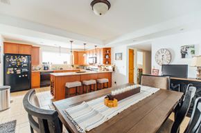 Chicago apartment for rent - a dining room table with a kitchen in the background