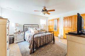 Chicago apartment for rent - a bedroom with a bed and a ceiling fan