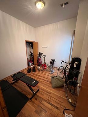 Chicago apartment for rent - a home gym with a lot of bikes and equipment in it