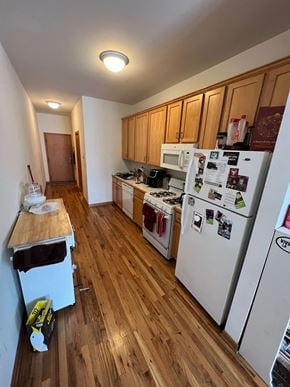 Chicago apartment for rent - a kitchen with a refrigerator and a stove and a table
