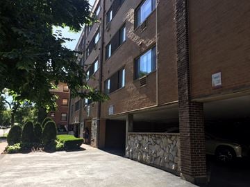 Evanston apartment for rent - a parking garage in front of a brick apartment building