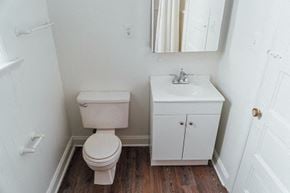 Chicago apartment for rent - a bathroom with a toilet sink and a mirror