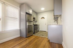 Chicago apartment for rent - a renovated kitchen with stainless steel appliances and wood flooring