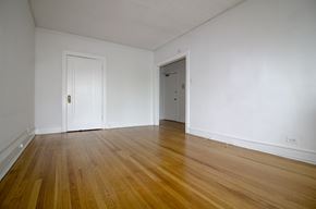 Evanston apartment for rent - an empty living room with white walls and wooden floors