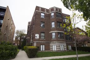 Evanston apartment for rent - a red brick building with a sidewalk in front of it