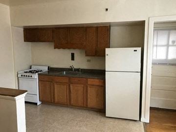 Evanston apartment for rent - a kitchen with a stove and a refrigerator