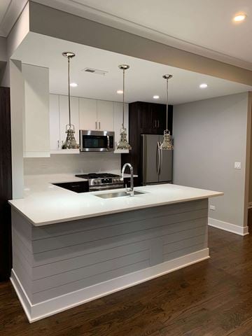 Chicago apartment for rent - a kitchen with a counter top and a sink