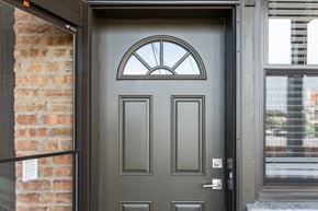 Chicago apartment for rent - a gray door with a window on top of it
