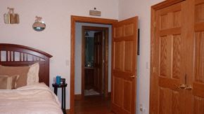 Chicago apartment for rent - a bedroom with a bed and two wooden doors