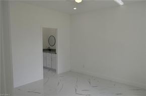 Lehigh Acres house for rent - a white room with a sink and a mirror in it