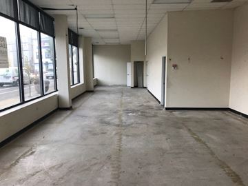Chicago apartment for rent - Empty office space with concrete floors and white walls.